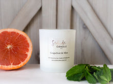 Load image into Gallery viewer, Revitalize your space with the invigorating blend of our Grapefruit & Mint candle. This refreshing scent combines the zesty aroma of ripe grapefruit with the cool essence of garden-fresh mint, creating a lively and uplifting atmosphere.