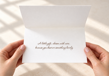 Load image into Gallery viewer, Open card held in hands, reading “A little gift, chosen with care, because you deserve something lovely.
