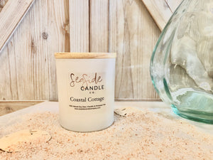 Escape to a tranquil beachside retreat with our Coastal Cottage candle. This elegant fragrance harmoniously blends refreshing bergamot and sea salt top notes with a heart of mint and peony, anchored by base notes of juniper, light musk, and marine accords, creating a soothing and atmospheric scent.