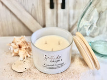 Load image into Gallery viewer, Escape to a tranquil beachside retreat with our Coastal Cottage candle. This elegant fragrance harmoniously blends refreshing bergamot and sea salt top notes with a heart of mint and peony, anchored by base notes of juniper, light musk, and marine accords, creating a soothing and atmospheric scent.