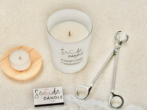 ✨ Introducing Our First Ever Candle Bundle – Coastal Cottage 🌊
Looking for the perfect way to treat yourself or gift someone special?
Our thoughtfully priced Coastal Cottage Bundle is a curated candle experience that brings elegance, fragrance, and function together in one beautiful set.

🕯️ Choose from 3 candle sizes
✂️ Select a black or silver wick trimmer
🔥 Includes a chic matchbook + surprise tealight in a different scent
🌊 Light our Coastal Cottage candle and let its soothing fragrance transport 